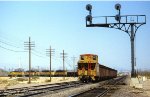UP, Union Pacific SD40-2s 3647-3787-3227-3534, with a eastbound ore train swing off the AT&SF, and on to the UP at Daggett, California. June 23, 1984. 